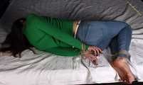 Roxana hogtied on bed