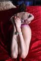Topless barefoot Peggy is being tied up and gagged on-screen