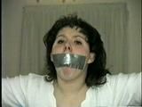 19 Yr OLD JENNIFER IS MOUTH STUFFED, TAPE GAGGED, TIED WITH ARMS OUT AND TO 2 PILLARS & CLEAVE GAGGED (D48-10)d, bondage
