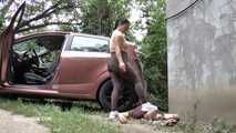 Mistress Jenna stands on the slave with a car while smoking in the slave's mouth B