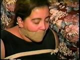 24 YR OLD LATINA HOUSEWIFE MOUTH STUFFED, WRAP TAPE GAGGED, BAREFOOT & TOE TIED (D61-11)