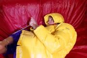 Sonja tied, gagged and hooded on a sofa wearing a sexy blue rain pants and a yellow downwear jacket (Pics)