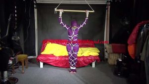Watching sexy Sonja wearing a supersexy purple shiny nylon rainwear combination being tied and gagged overhead with ropes and a clothgag (Video)