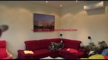 Jill tied, gagged and hooded on a red sofa wearing sexy shiny nylon camouflage rainwear (Video)