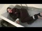 Watch Maggy beeing bound and gagged in a bathtube wearing a shiny nylon Skisuit from our Archives 2012