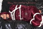 Lucy tied, gagged and hooded on a sofa wearing a sexy darkred downwear combination (Pics)