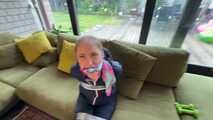 Rachel Adams bound and gagged by an Intruder in shiny Rainwear