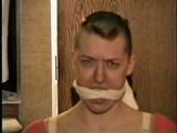 PUNK MELA IS BAREFOOT,MOUTH STUFFED, CLEAVE GAGGED, TOE-TIED & TRIES TO MAKE PHONE CALL (D43-11)
