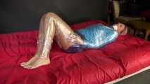 Watching sexy Pia being envelopped in film wearing a sexy blue shiny nylon shorts and a lightblue shiny nylon rainjacket (Video)