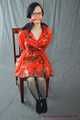 Bound in PVC minidress and red raincoat