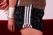 Nicole tied and gagged in black shorts