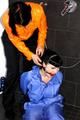 Jill bound and gagged by Simone in shiny nylon rainwear
