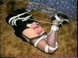 BOUND IN BLACK PANTIES, DRESS, GARTER BELT, HEELS & CLEAVE GAG SUZIE (D24-14)