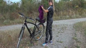 Get a Video with Sandra riding her bike enjoying her shiny nylon Rainwear
