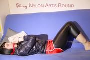 Mara ties and gagges herself with hand cuffs on a sofa wearing a supersexy black Leggings and a shiny nylon shorts and a rain jacket (Pics)