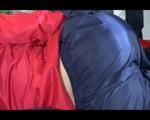 Sonja posing and lolling on bed wearing a sexy blue/red rainwear combination (Video)