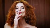 Wild and free girl Yuliya is definitely enjoying a strong 100mm black cigarette