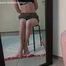 Emily bound with rope, sittin on the stool