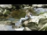 Sophie enjoying the water and weather on a river wearing supersexy grey sauna pvc rainwear (Video)