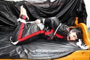 Jill bound and gagged in a shiny nylon skisuit