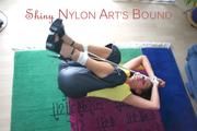 Stella tied and gagged on the floor wearing a shiny nylon rain pants (Pics)