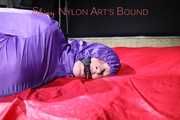 Sonja tied, gagged and hooded with ropes and a cloth gag on the sofa wearing a supersexy blue rain pants and a purple rain jacket (Pics)