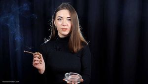 Beauty Katya is smoking 120mm cigarette in the studio