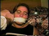 24 YR OLD LATINA HOUSEWIFE MOUTH STUFFED, WRAP TAPE GAGGED, BAREFOOT & TOE TIED (D61-11)