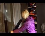 Sonja wearing a sexy purple shiny nylon rainwear combination during reordering the cupboard (Video)