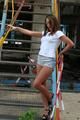 Stella posing outdoor on a stairway wearing sexy shiny nylon shorts (Pics)