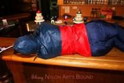 Jill tied and gagged in shiny rainwear