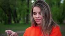 Pretty Kate is smoking Marlboro Red 100s in the park