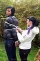 Jill ties her friend in shiny downjackets