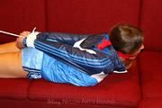 Katharina bound and gagged in shiny nylon shorts