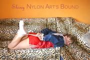 Beautiful archive girl tied and gagged wearing an wonderful red shiny nylon shorts and a shiny red rain jacket (Pics)