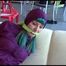 Mara tied and gagged on a sofa wearing a shiny purple rainwear combination (Video) 