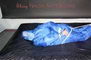 Lucy wearing sexy lightblue downwear tied and gagged with ropes and cloth gag on a bed (Pics)