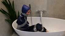 Myxxxy surprised by an Intruder in her Bathroom finally bound and gagged in Rainwear