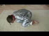 Video with Alina tied and gagged in a shiny pvc sauna suit