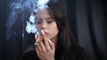 Beautiful Woman Smoking a Cigar