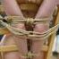 Blonde girl tied up on a chair