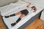 Spread eagle on bed
