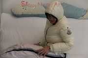 SEXY Jill wearing a WHITE rain pants and a WHITE down jacket lolling on the sofa playing with you (Pics)