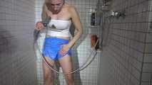 SEXY SANDRA in the shower with a sexy lightblue shiny nylon shorts and a top (Video)