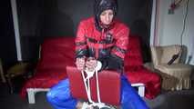 Sexy Pia being tied and gagged on a chair wearing sexy shiny nylon rainwear (Video)