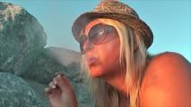 Smoking nude on the beach