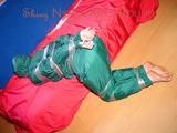 Jill tied, gagged and hooded on a sofa with tape wearing supersexy shiny nylon oldschool rainwear (Pics)