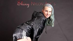 Mara wearing a sexy black shiny nylon shorts and a black rain jacket posing for you (Pics)