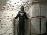 Archive girl tied, gagged and hooded in a cellar wearing a shiny black downcoat (Video)