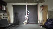 Marie taped and suspended in shiny nylon Rainwear